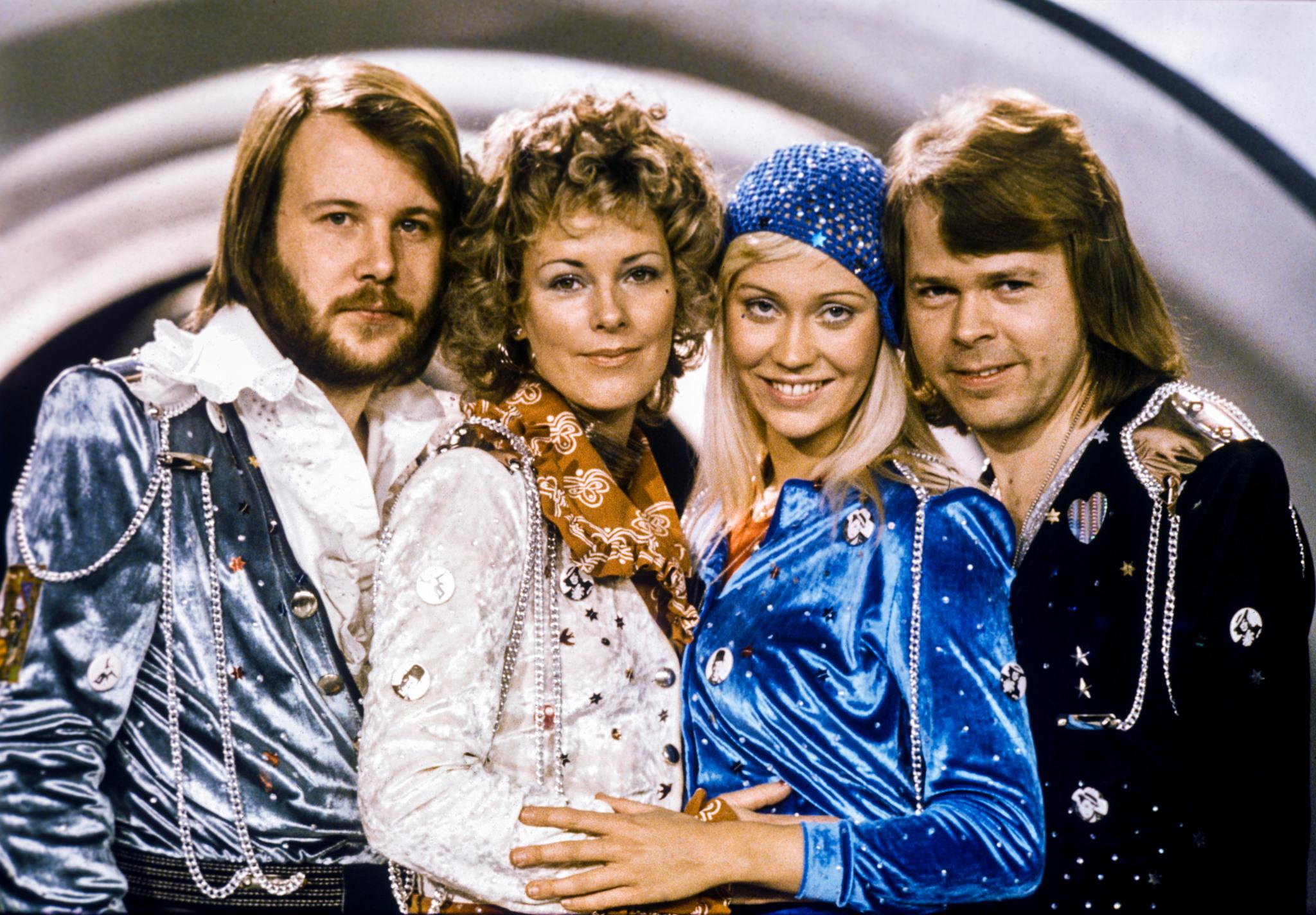 The four members of ABBA posing in their winning Eurovision outfits.