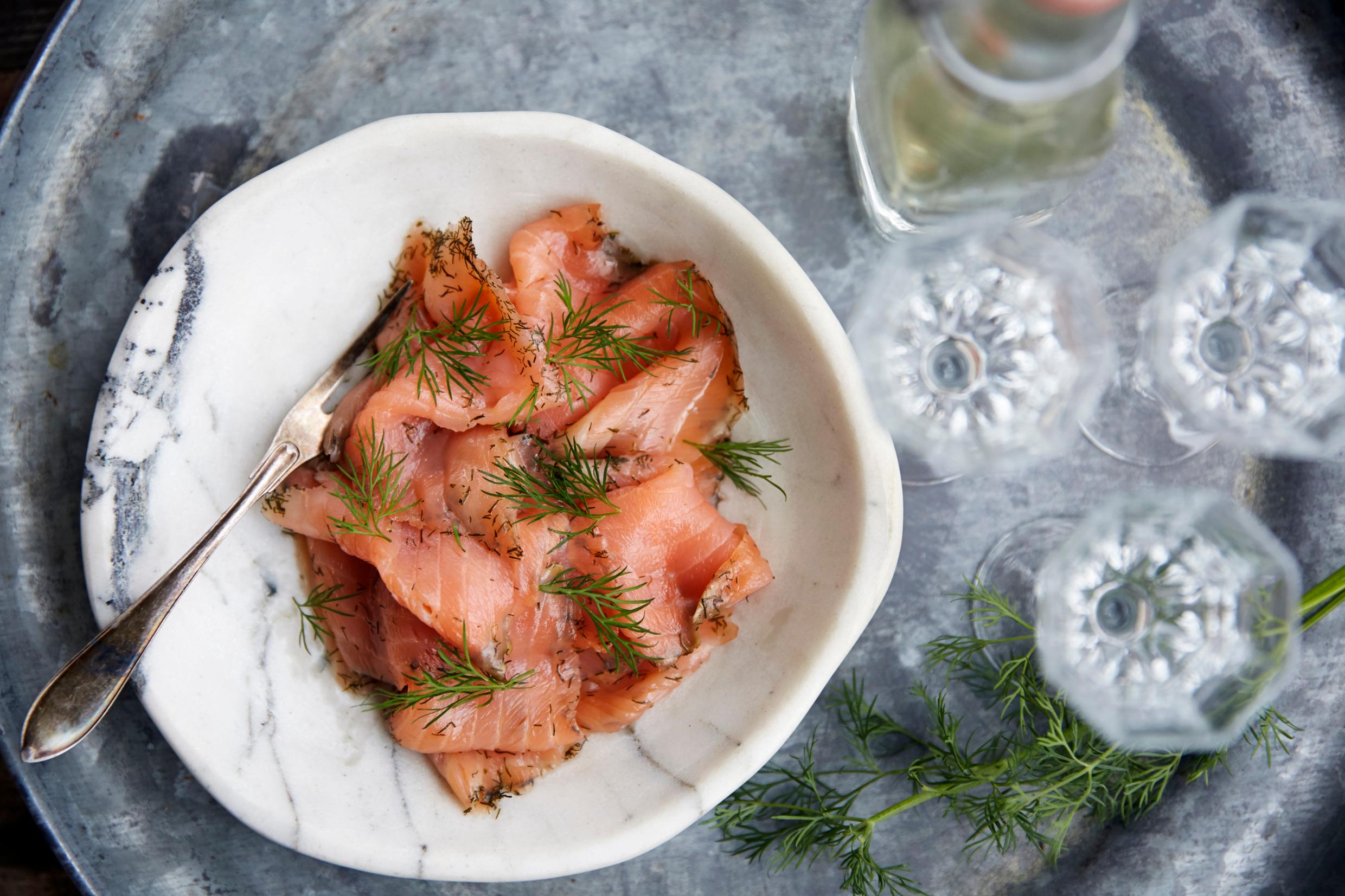 Cured salmon, gravlax, on a plate.