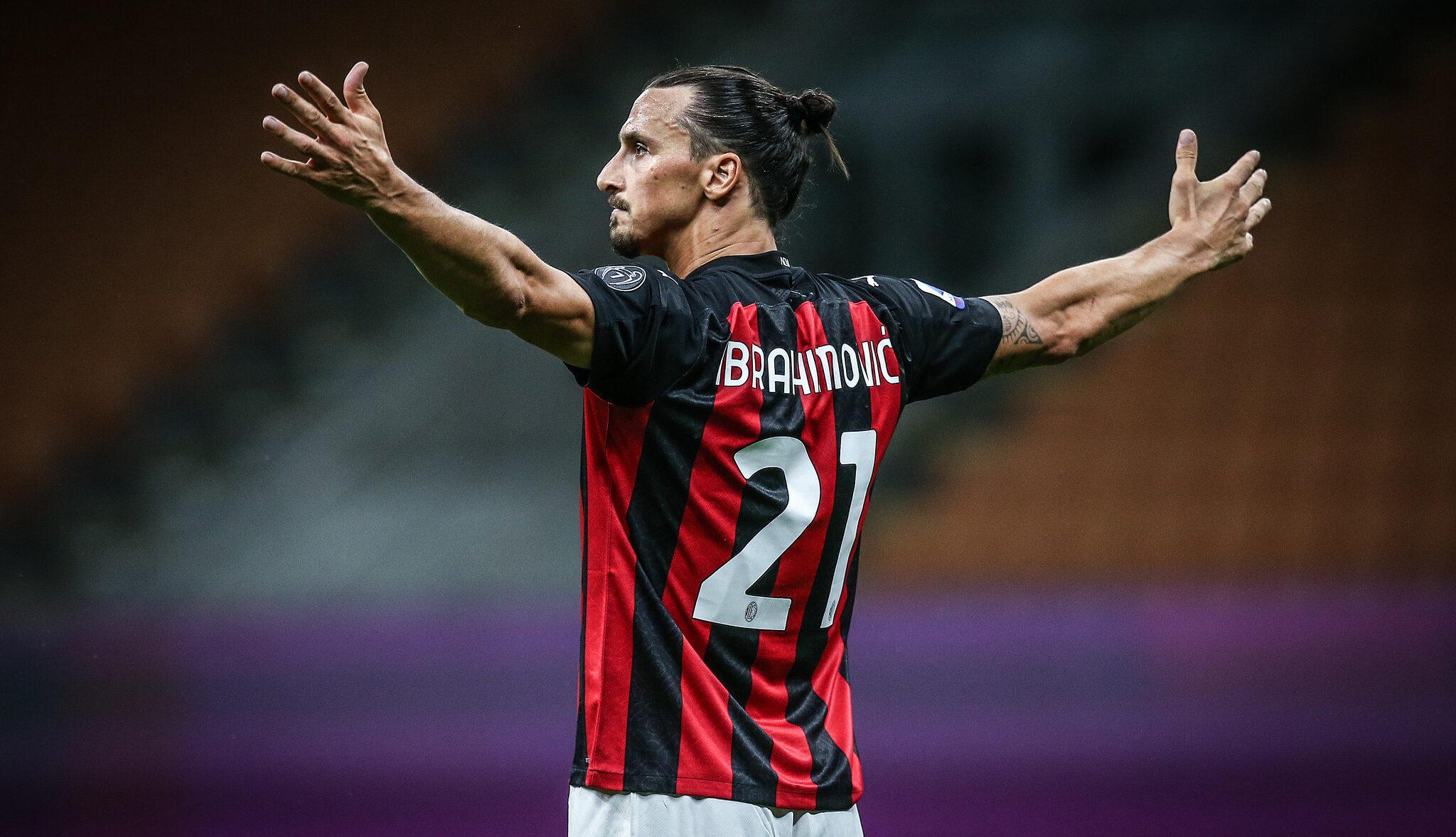 Zlatan Ibrahimović makes a winning gesture, arms stretch right out.