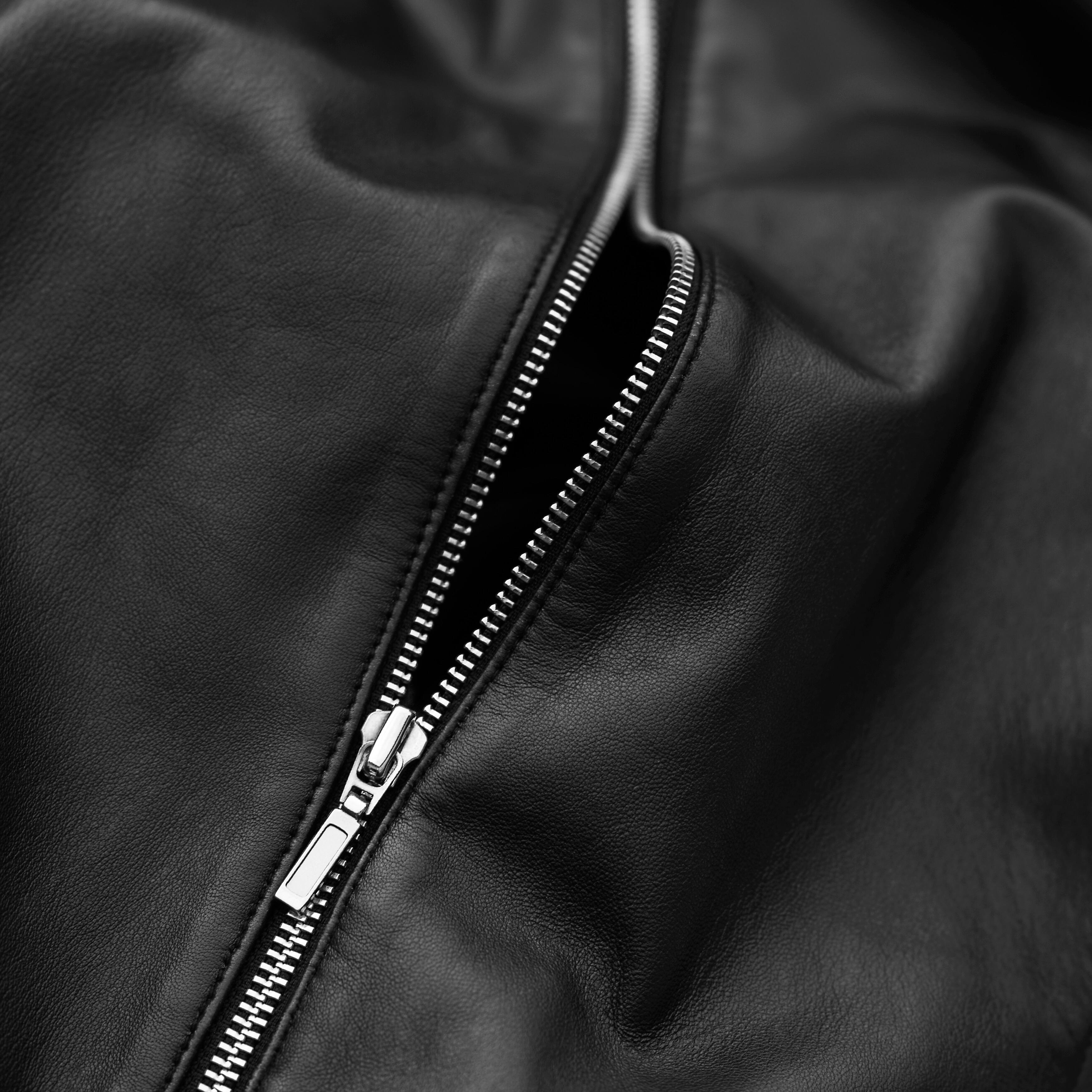 A zip in a black jacket.
