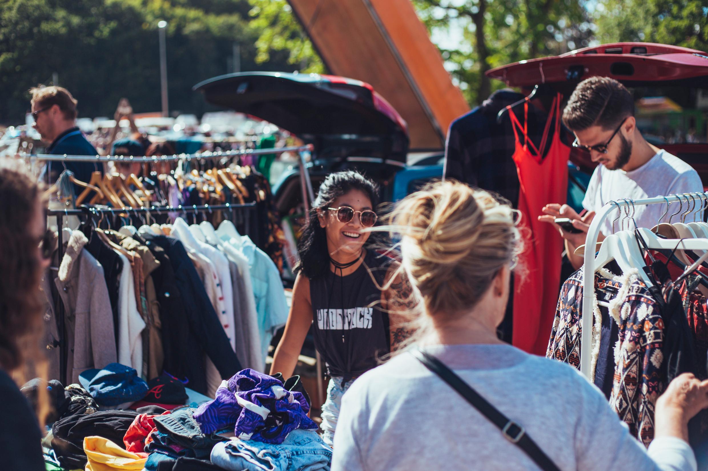 Shoppers at an outdoors flea market.