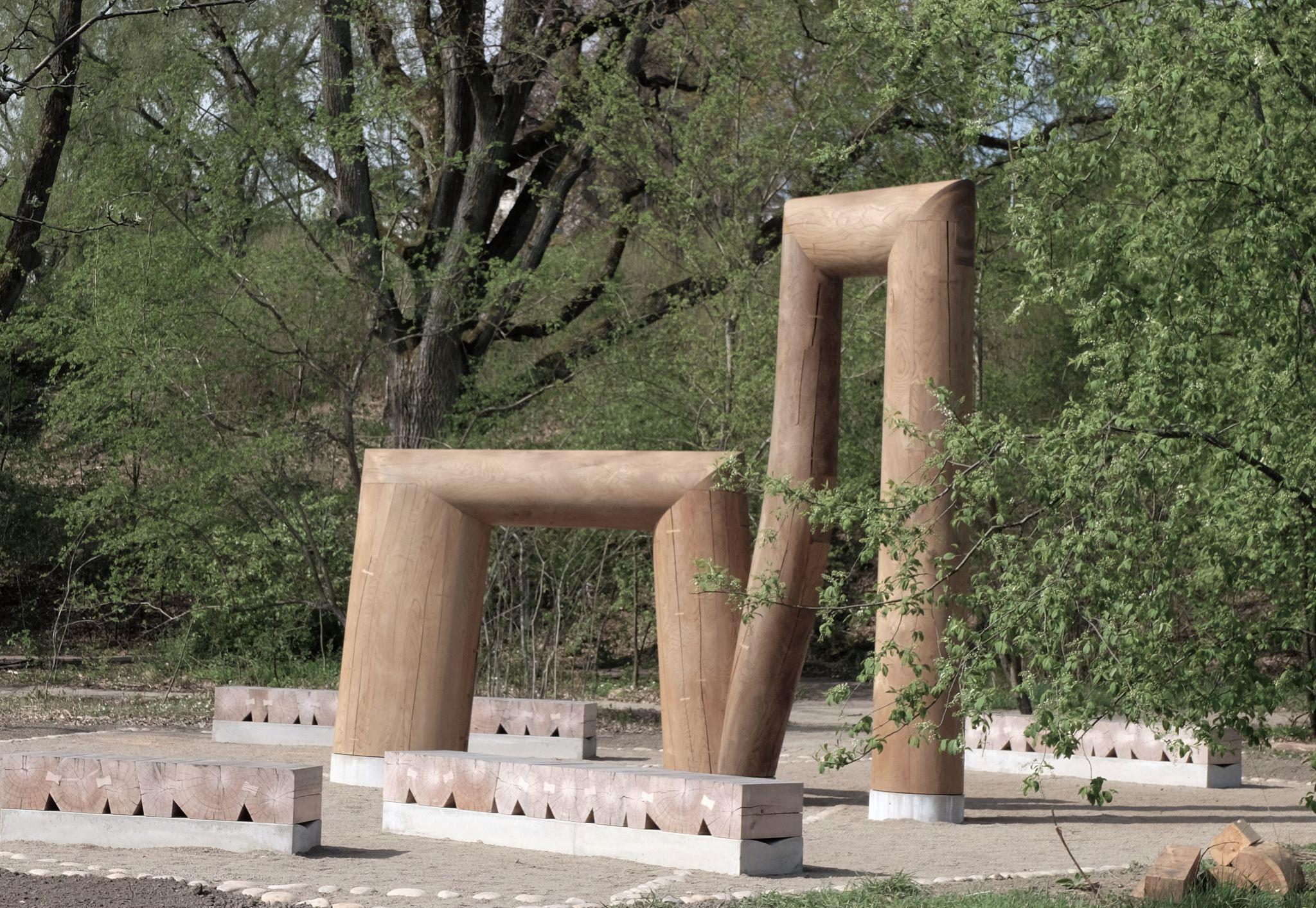 Two wooden structures in a public space.