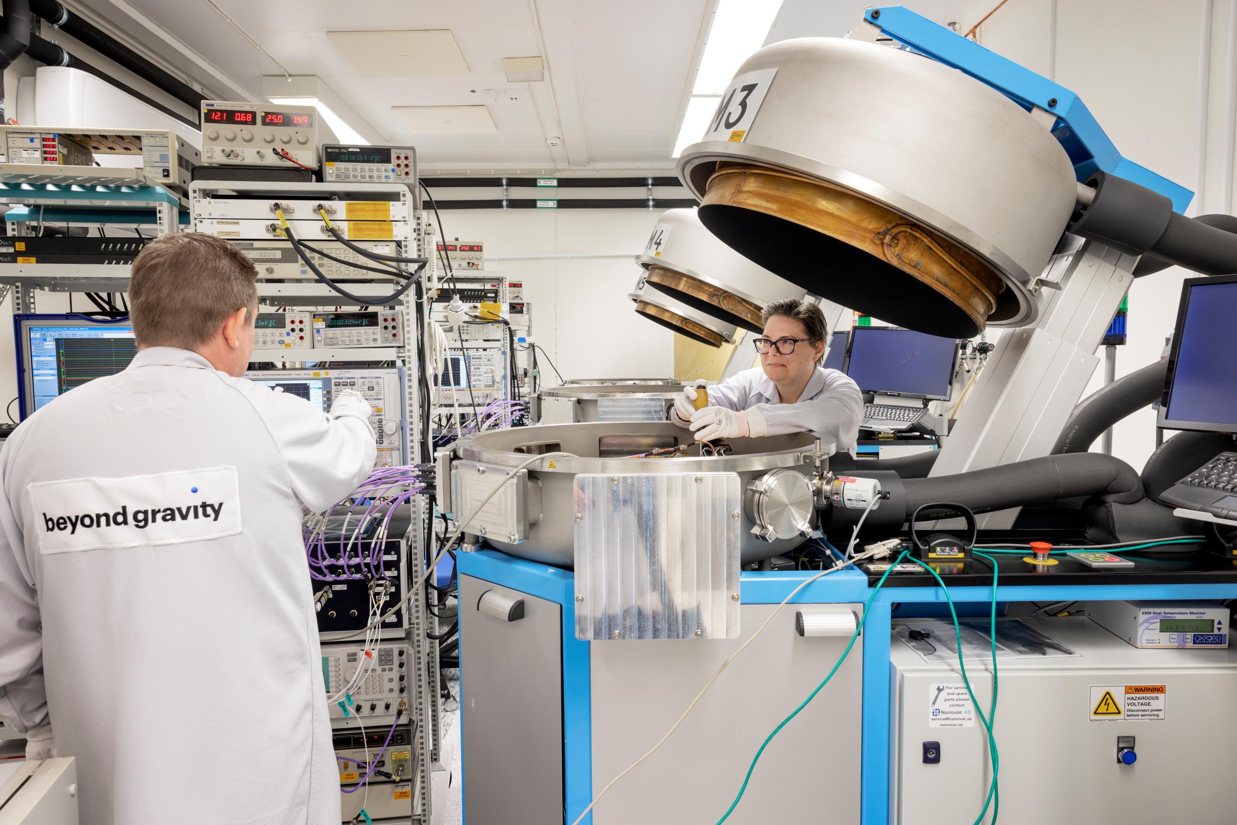 Two people working in a lab.