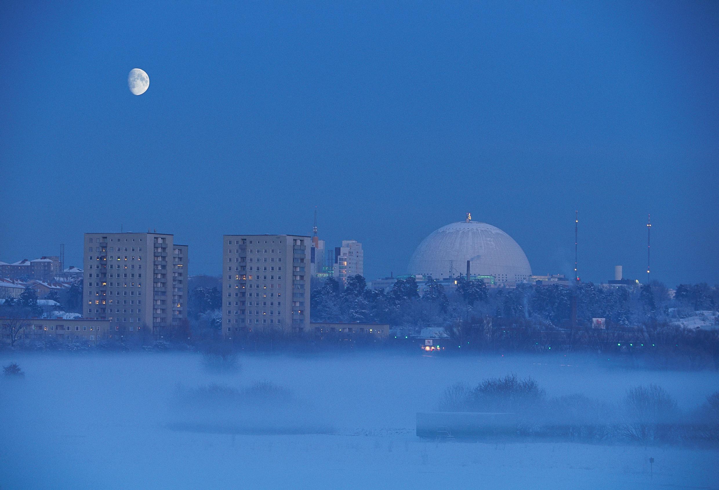 A skyline view with a large hemispherical building in the centre.