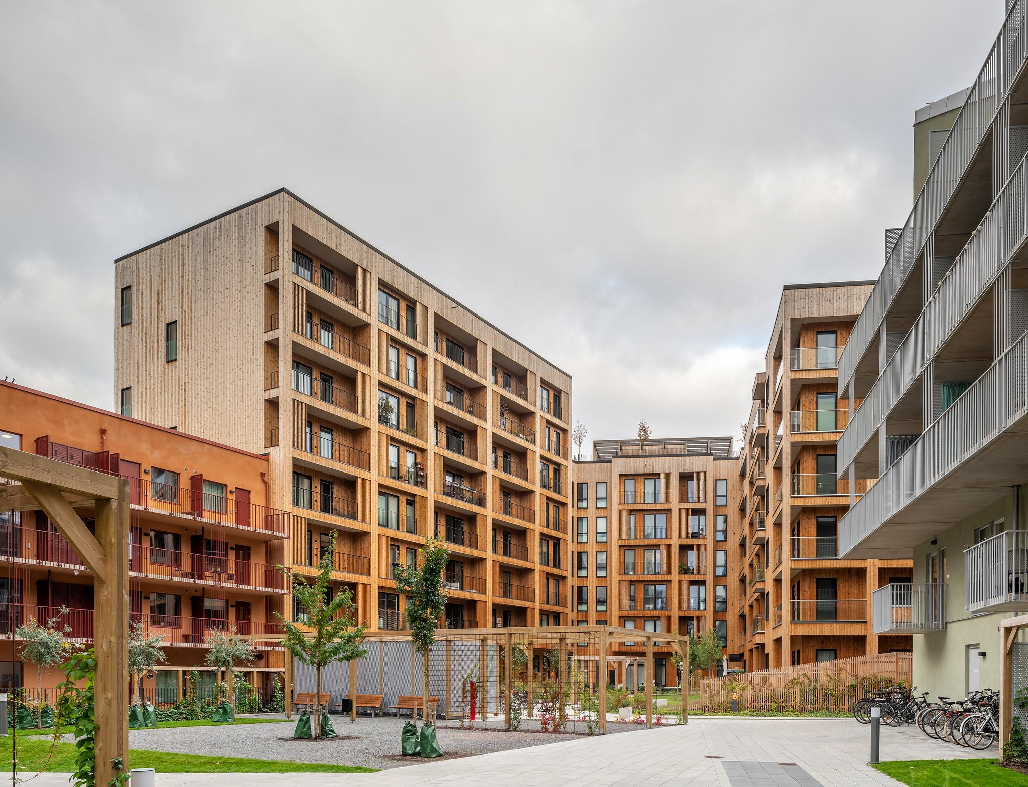 A block of flats, all clad in wood.