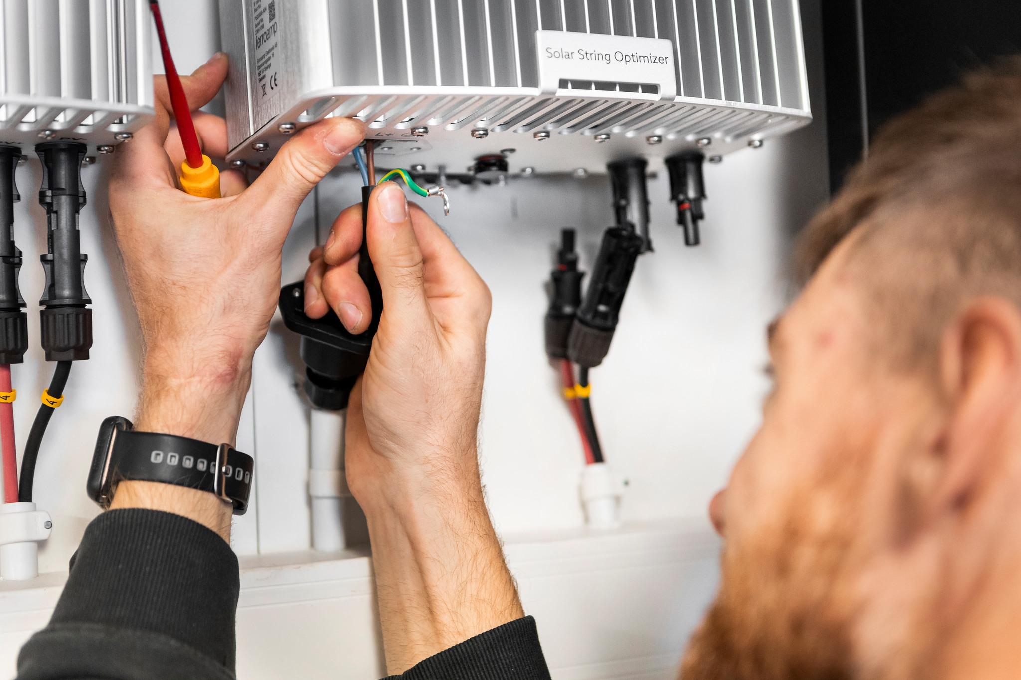 Man doing electrical work.