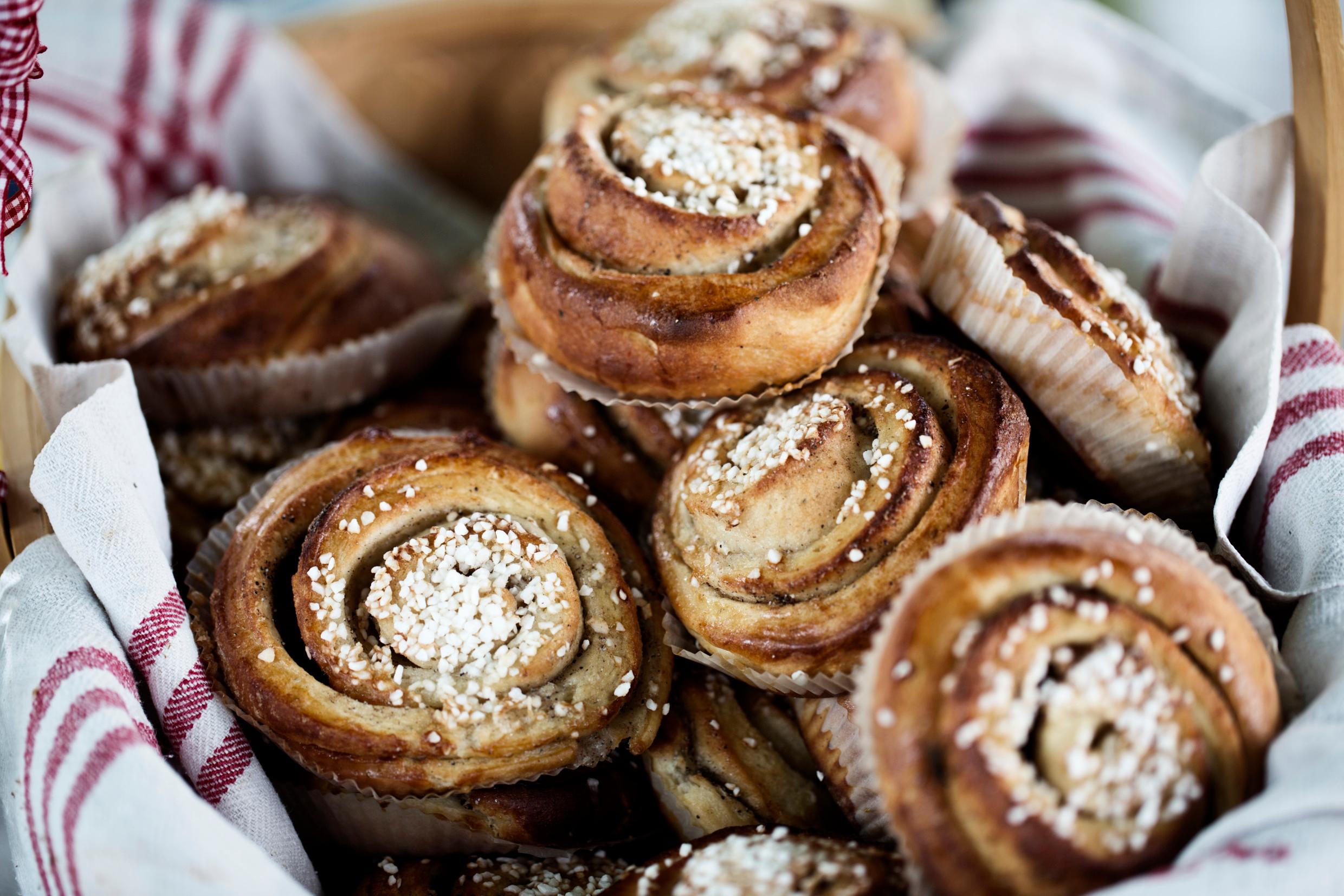 A basket filled with cinnamon buns.