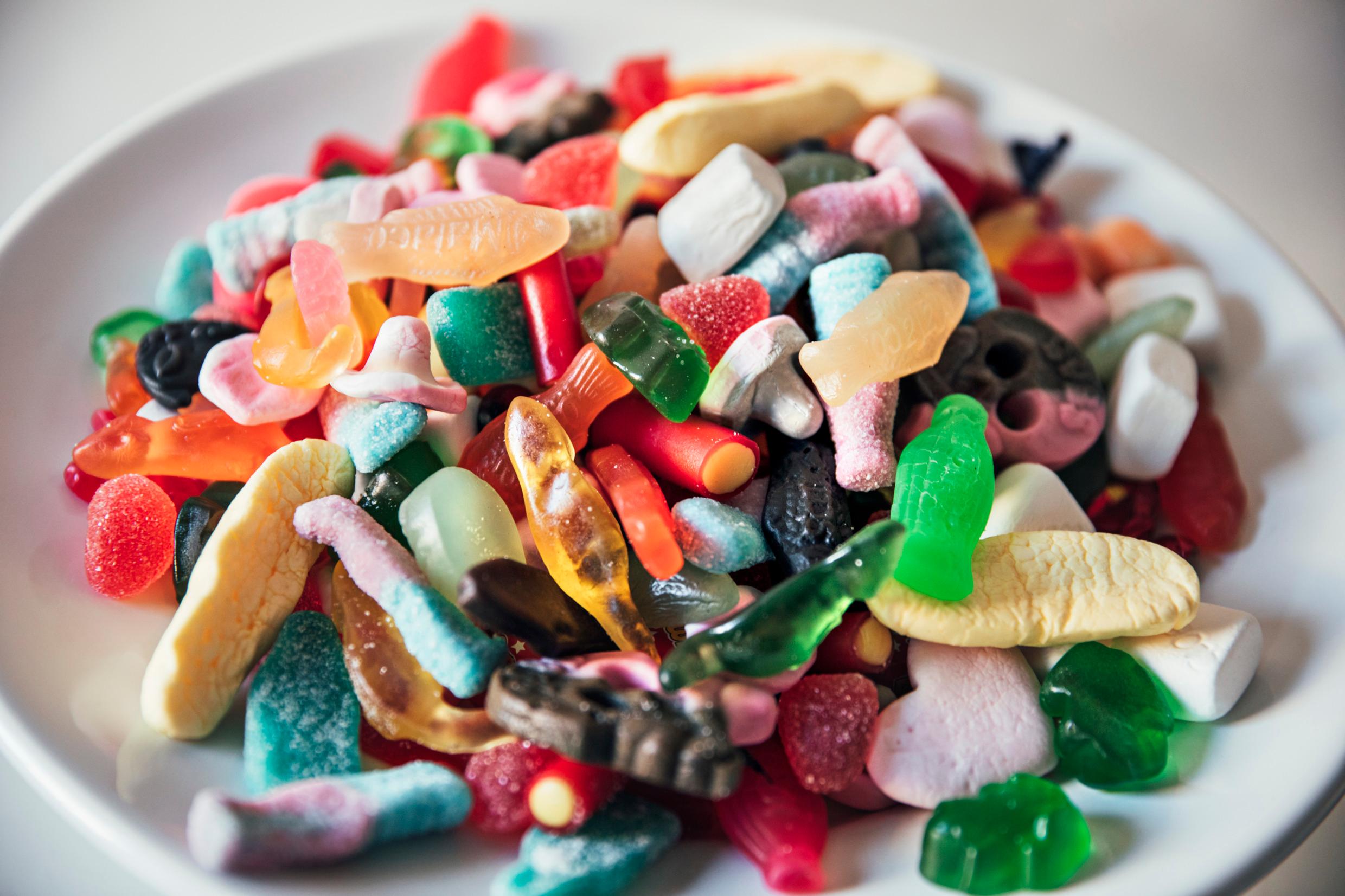 A big pile of pick-and-mix sweets on a plate.