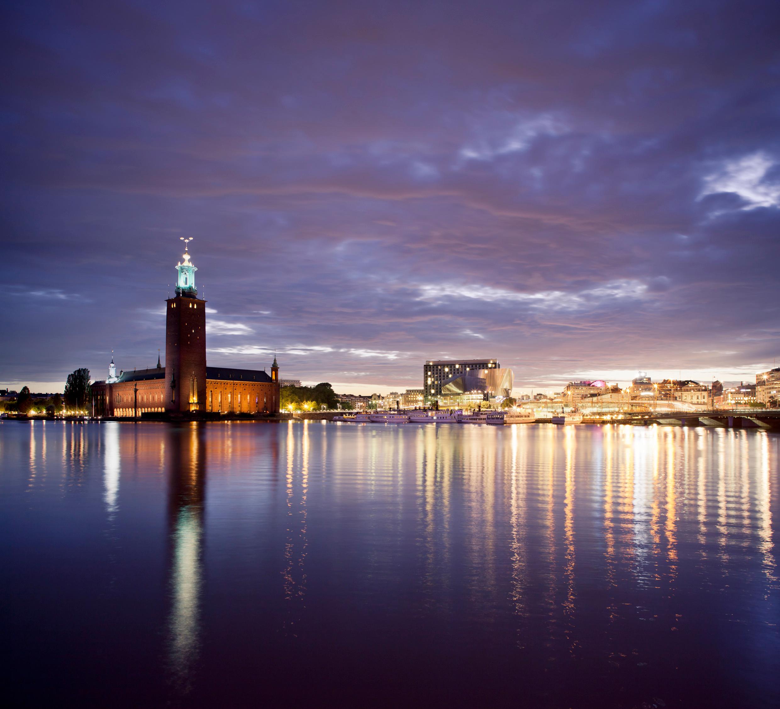Night-time view across the water to Stockholm City Hall.