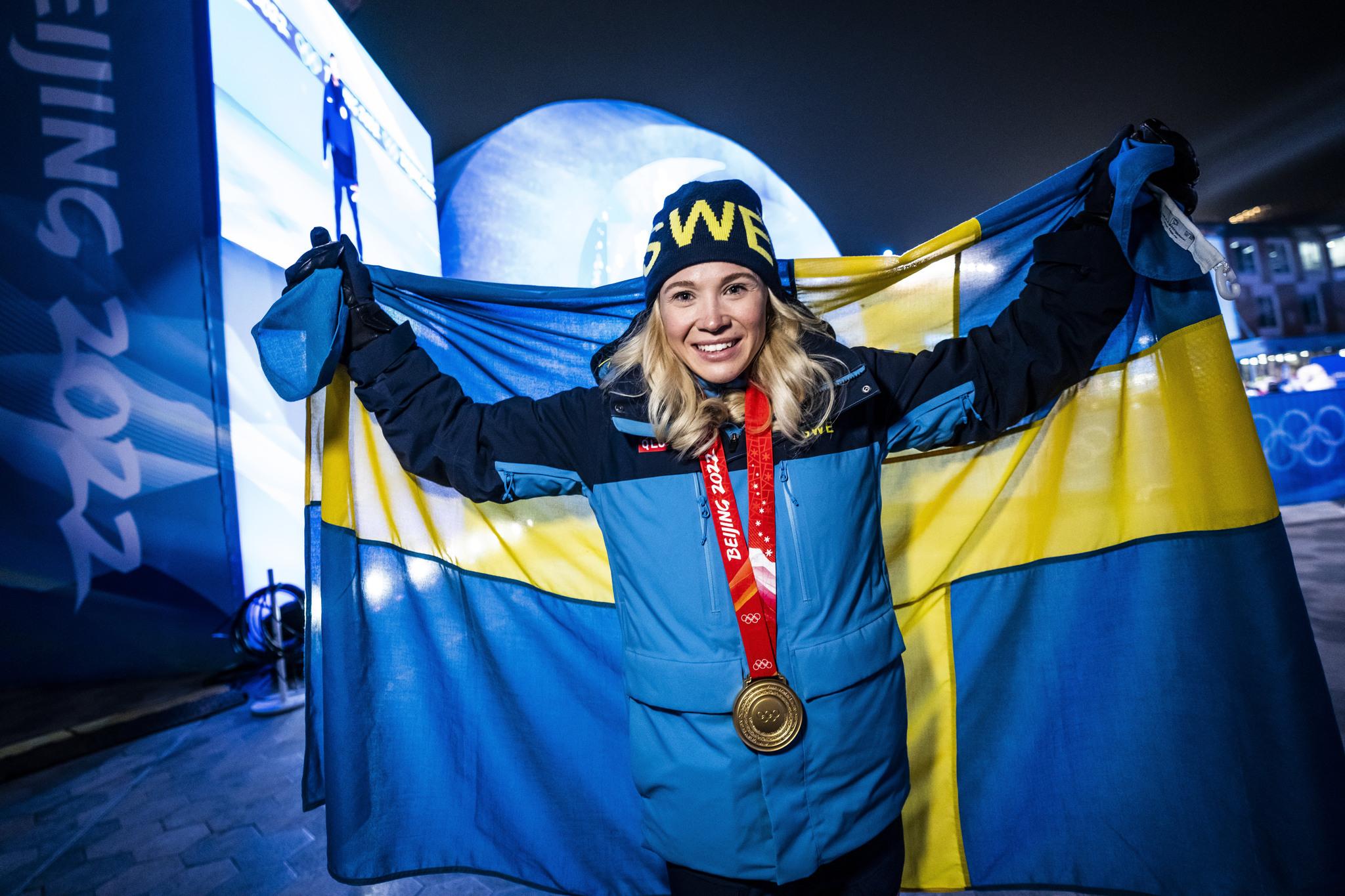 Jonna Sundling celebrates her freestyle sprint gold at the 2022 Winter Olympics.