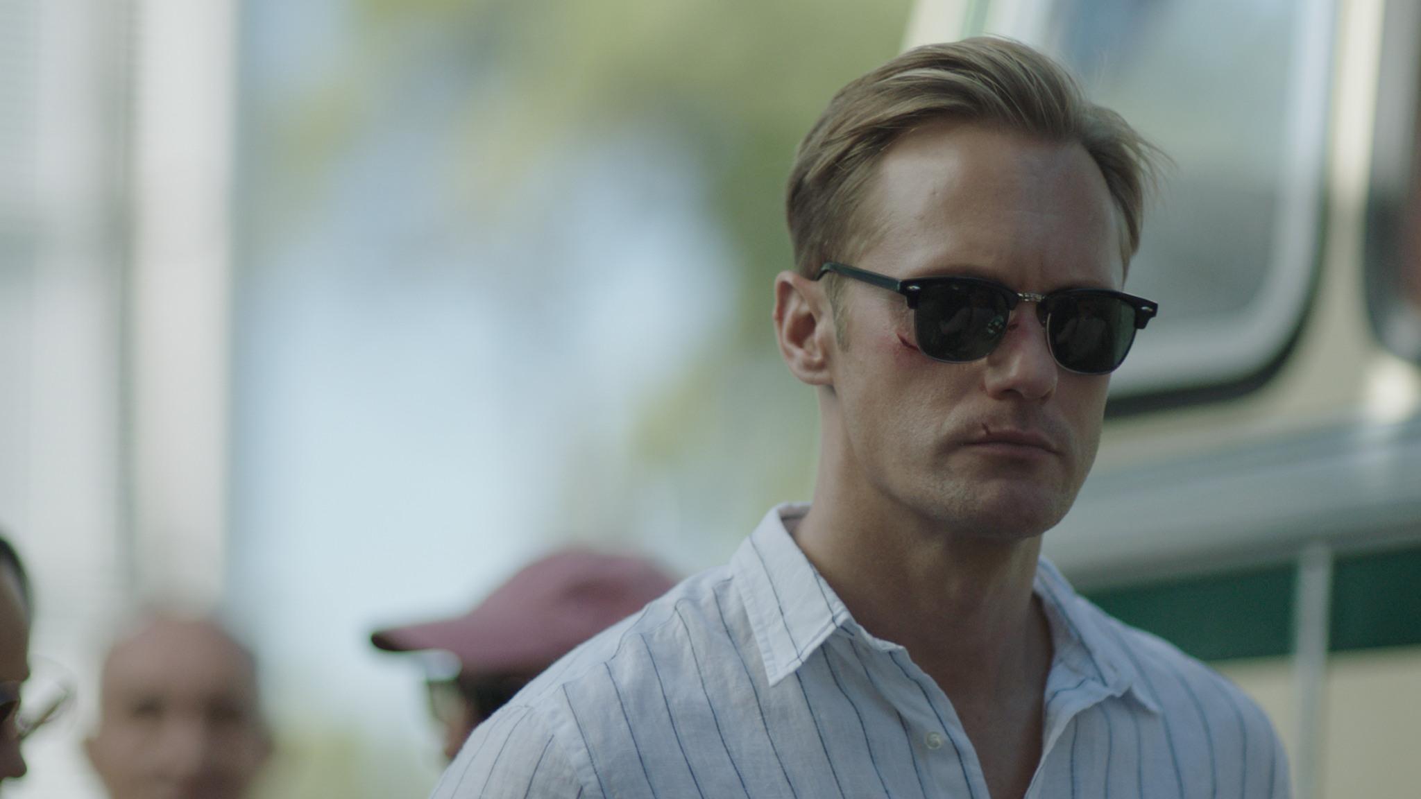 Still from the film 'Infinity Pool' showing Alexander Skarsgård wearing sunglasses.