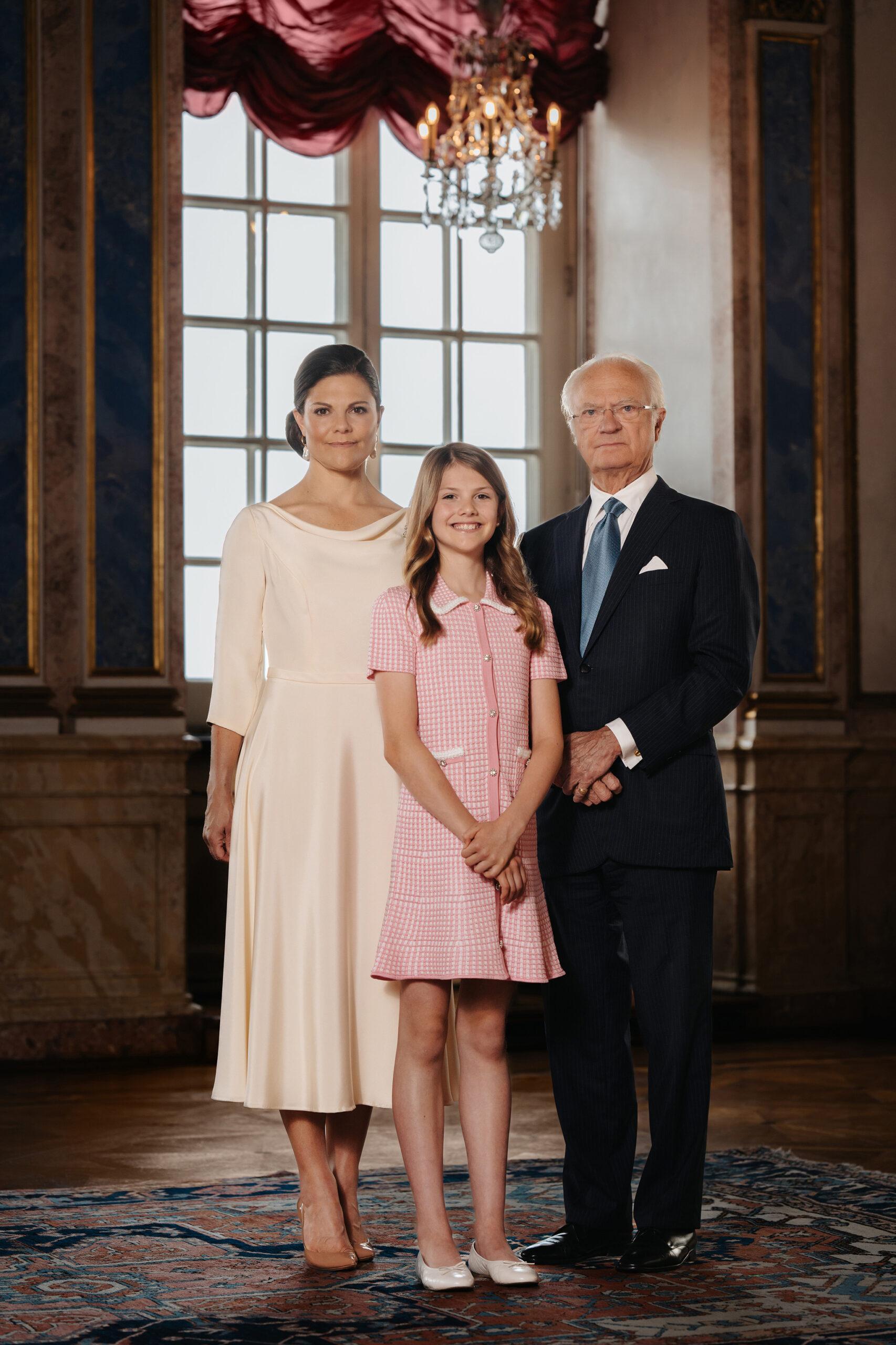 Group portrait of the Swedish King, Crown Princess Victoria and Princess Estelle.
